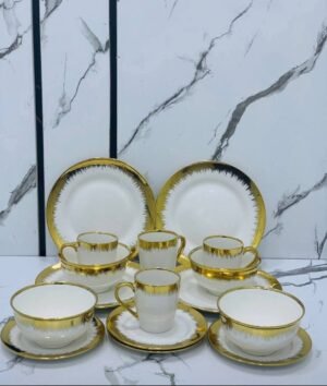 16-piece white ceramic dinner set featuring a luxury drip-effect gold trim - Image 2