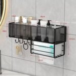 Metal mesh bathroom organizer with adhesive wall hooks and a tissue dispenser.