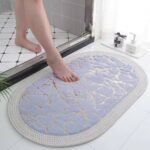Marble-patterned oval bathroom floor mat